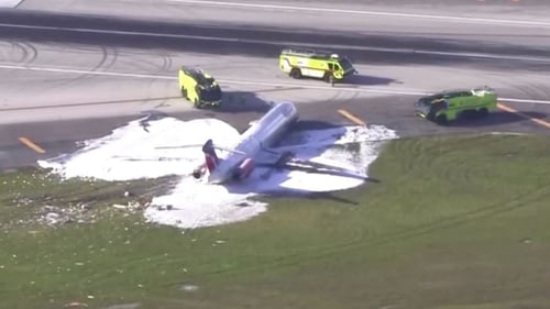 The landing gear collapsed as the plane touched down at Miami international airport