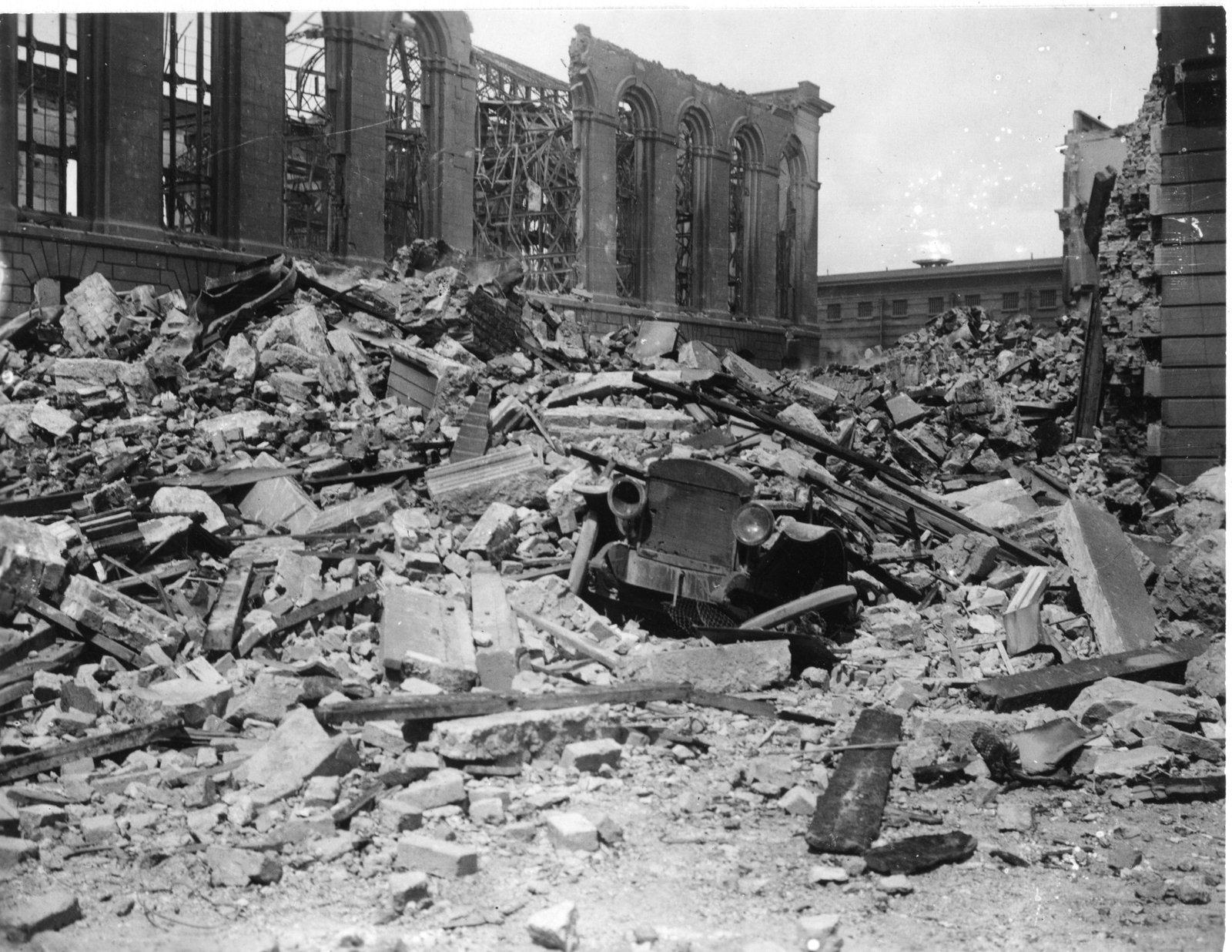 Image - The scene of the explosion, with the burnt-out Public Records Office in the background. Image courtesy of the Irish Architectural Archive
