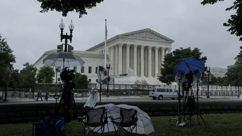 A TV crew's equipment covered from rain outside US Supreme Court in Washington DC today