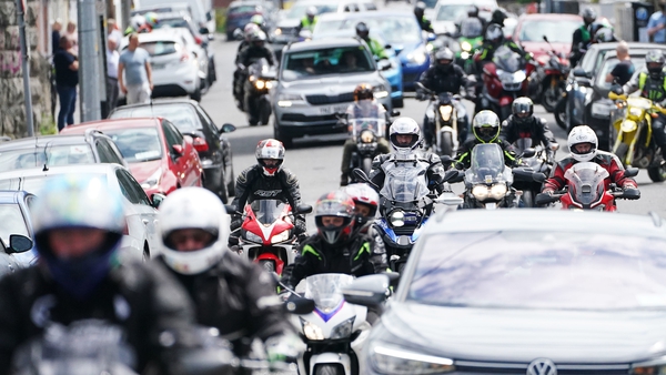 Motorcyclists follow the hearse carrying Jack Oliver as it leaves Navan for his return home to Limavady