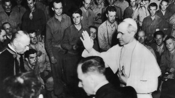 Pope Pius XII blesses a group of war correspondents in the Vatican, shortly after the liberation of Rome during World War II