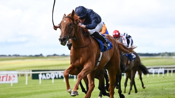 Statuette, with Ryan Moore up, on their way to winning the Airlie Stud Stakes