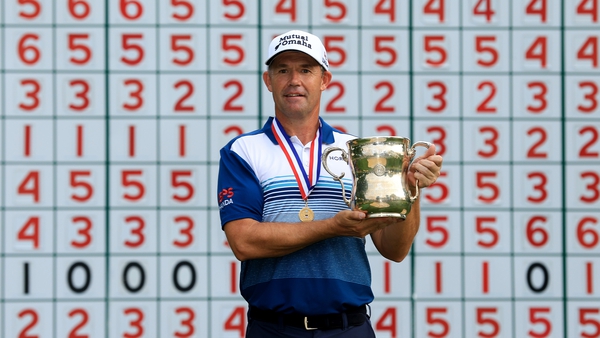 Padraig Harrington poses with the trophy and gold medal