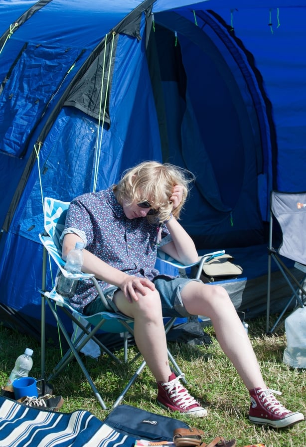 festivalgoer suffering the morning after