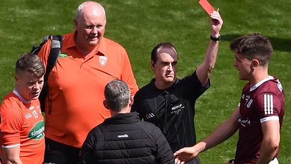 Referee David Coldrick sent off Aidan Nugent (left) and Seán Kelly (right) before the start of extra-time