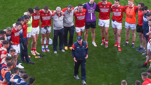 John Cleary speaks to his players after Cork's defeat by Dublin