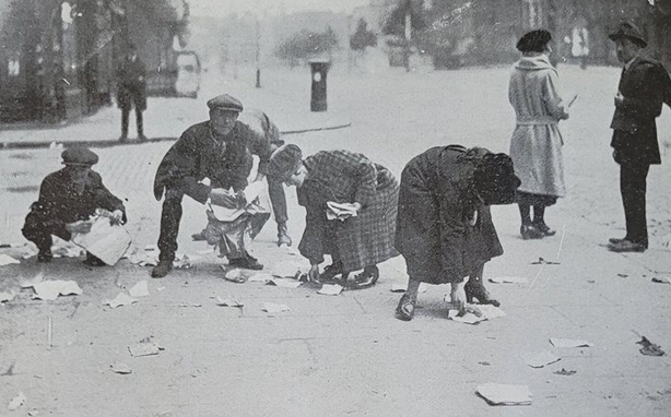 People picking up documents blown out of the Four Courts during the Battle of Dublin Photo: Irish Life, June 30th, July 7th and 14th