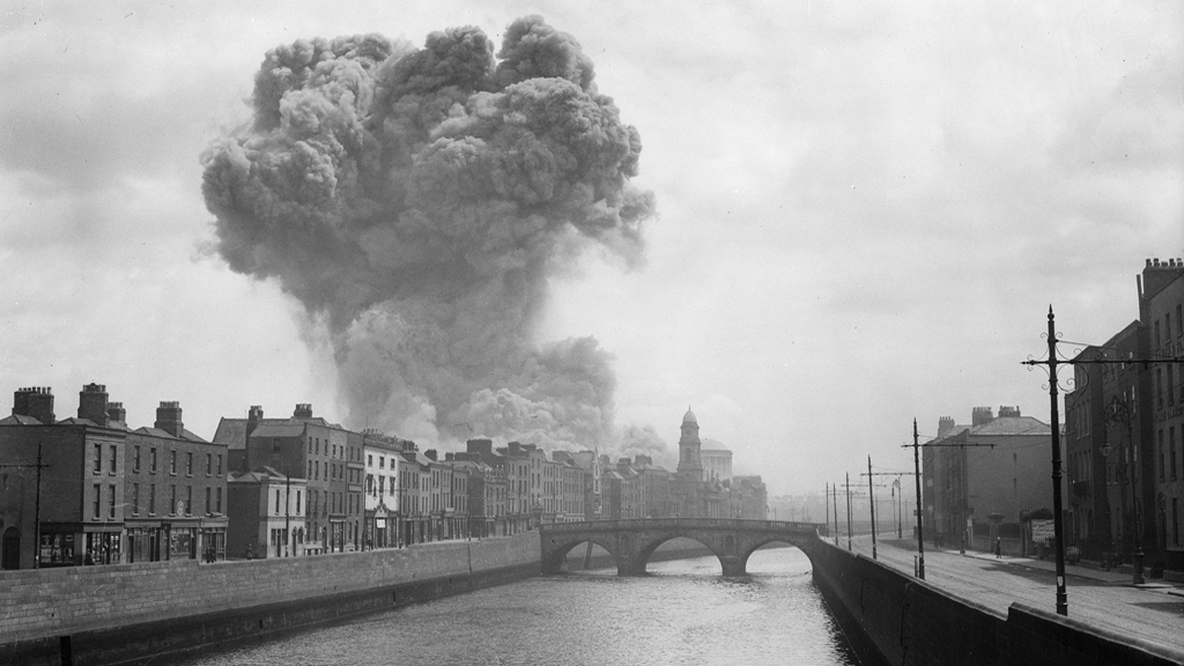 During the Civil War smoke rises above the city of Dublin, after the Irregulars ammunition store in the grounds of the Four Courts, was hit by a Free State shell on 30 June 1922. RTÉ Photographic Archive, Cashman Collection 0504/068