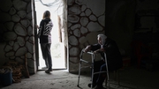 Lybov, 90, sits in a basement as she shelters from shelling in Siversk, about 30km from Lysychansk in east Ukraine