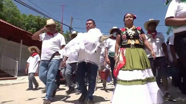 San Pedro Huamelula Mayor Victor Hugo Sosa heads to the wedding ceremony with his 'little princess' bride