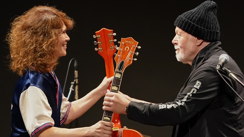 Japanese musician Takeshi (L) and Randy Bachman (R) exchange guitars on stage. Bachman's long-missing guitar eventually found its way to the Japanese musician