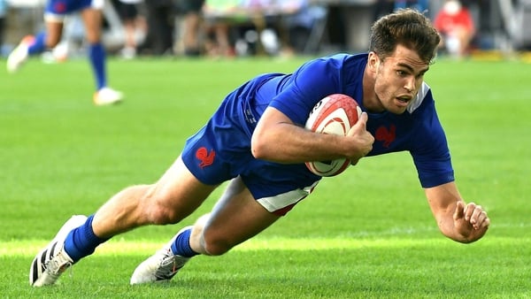 Damian Penaud touches down for one of his two tries in Japan