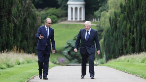 British Prime Minister Boris Johnson and Taoiseach Micheál Martin walking in the gardens of Hillsborough Castle in Belfast last August