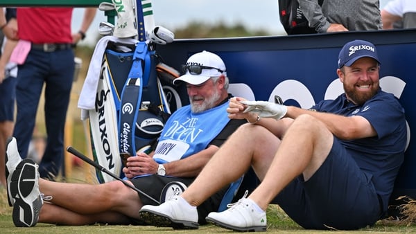 Shane Lowry and caddie Bo Martin take a break during today's practice round at St Andrews