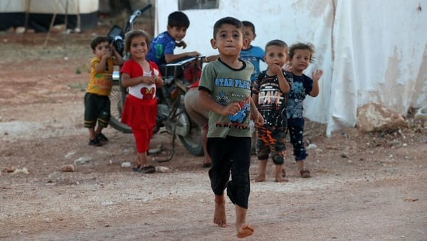 Syrian children displaced by the conflict playing at a camp in the rebel-held part of Idlib province