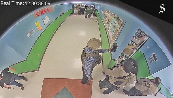 Video showed police officers in the corridor for more than an hour after the gunman entered a classroom