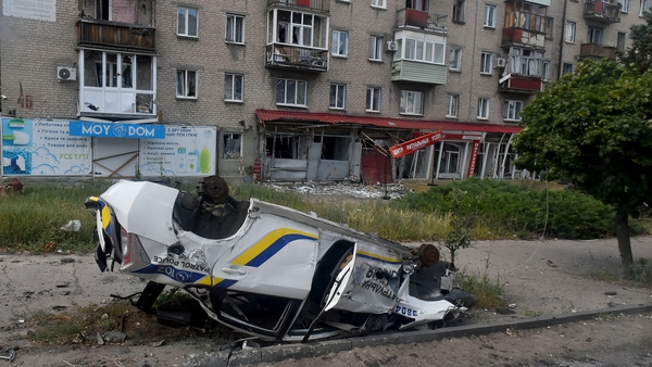 A destroyed police car is pictured in the city of Lysychansk on 12 July