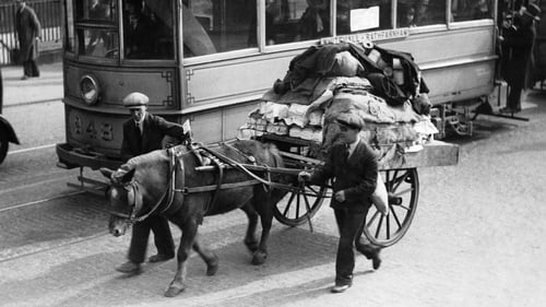 Two unemployed men pulling a pony and cart loaded through the streets of Dublin in 1933. Photo: Keystone-France/Gamma-Rapho via Getty Images