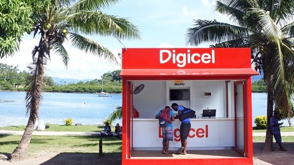 Customers shop at a Digicel Pacific Limited store for mobile phones in Fiji