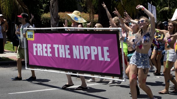 Young women demanding to go topless with the slogan "Free the nipple" at the San Diego Pride Parade