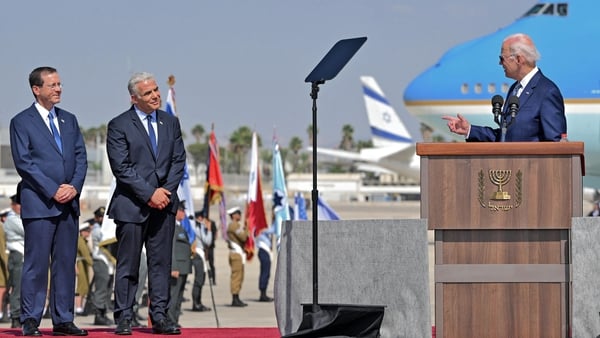 Israel's President Isaac Herzog (L) and caretaker Prime Minister Yair Lapid (C) listen to US President Joe Biden (R) as he addresses his hosts upon his arrival at Ben Gurion Airport near Tel Aviv yesterday