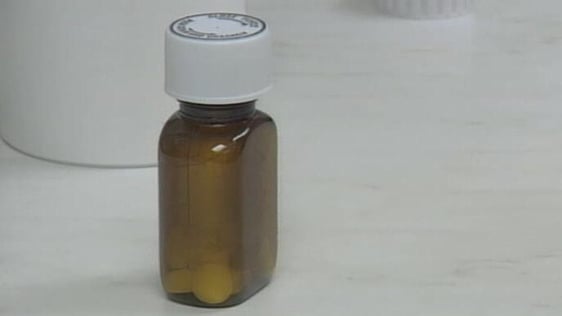 Bottle of tablets in pharmacy (2002)
