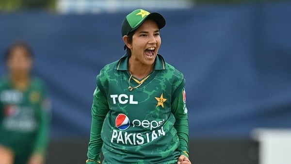 Anam Amin of Pakistan celebrates running out Laura Delany.
