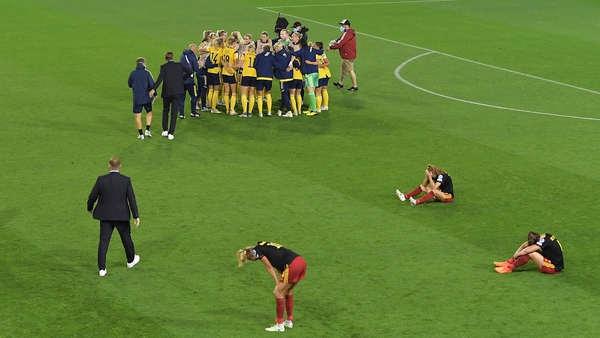Sweden players celebrate victory over Belgium