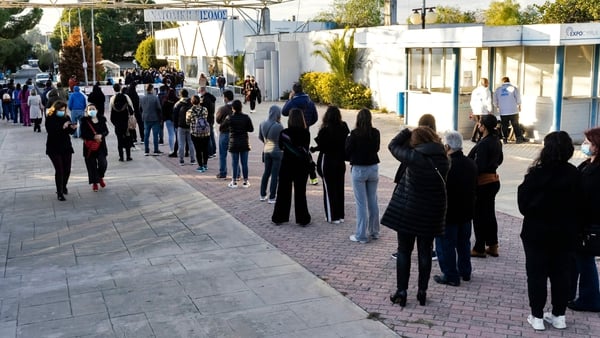 People queue at a Covid-19 vaccination centre in Cyprus