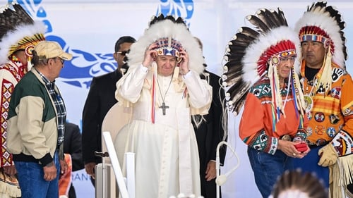 Pope Francis wears a headdress presented to him last year by indigenous leaders in Maskwacis, Alberta, Canada