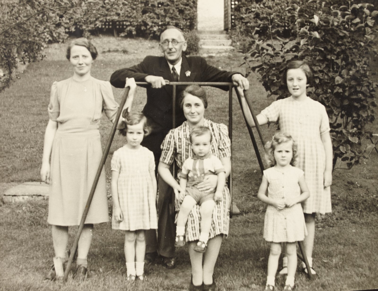 Image - W.D Hogan photographed with an unidentified group of women and children. Image courtesy of the National Library of Ireland
