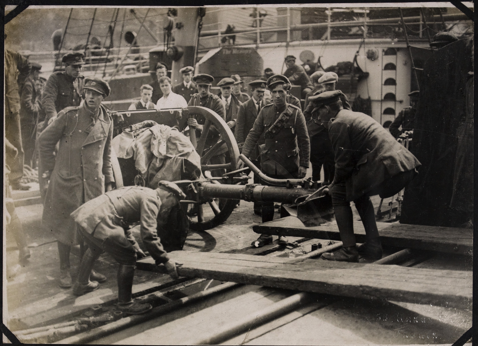 Image - National Army troops removing a heavy gun from the boat at Passage West. Cork. Image courtesy of the National Library of Ireland
