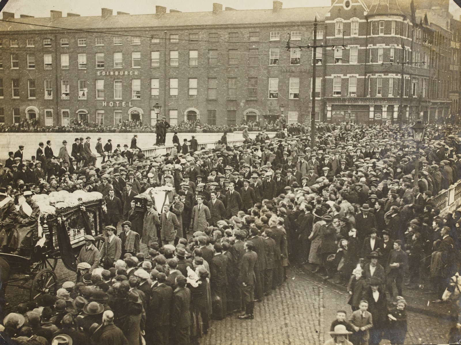 Image - A photograph by Hogan of the funeral of a prominent Republican passing over St. Patrick's Bridge, Cork Image courtesy of the National Library of Ireland