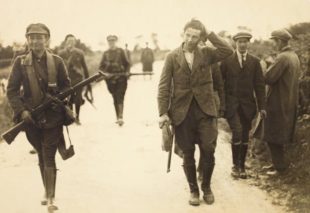 A prisoner under escort at the South Western Front during the Irish Civil War Photo: National Library of Ireland, 22 July 1922