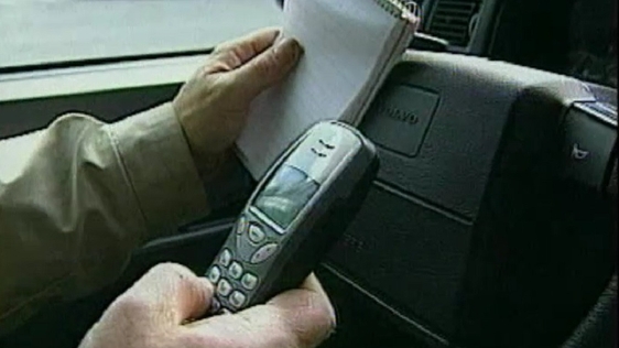 Ban on mobile phone use while driving (2002)