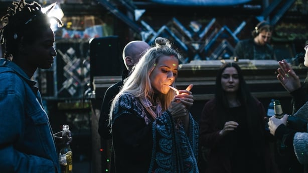 woman smoking a joint at a party