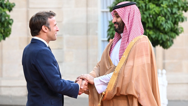 France's President Emmanuel Macron greets Saudi Crown Prince Mohammed bin Salman at presidential Elysee Palace