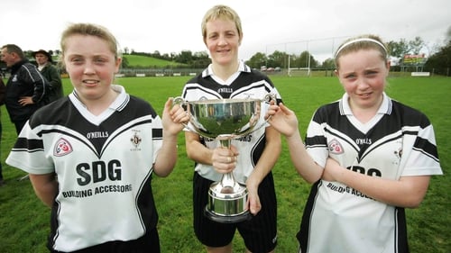 Brenda McAnespie with her twin daughters Aoife and Ciara (right) following Emyvale's victory in the Ulster Junior Club football final in 2006