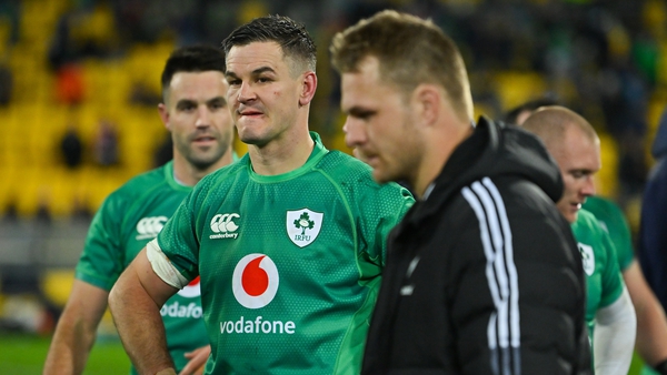 A dejected Sam Cane walks past Ireland captain Jonathan Sexton match July's test in Wellington