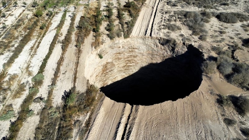 The sinkhole measures about 25 metres (82 feet) in diameter