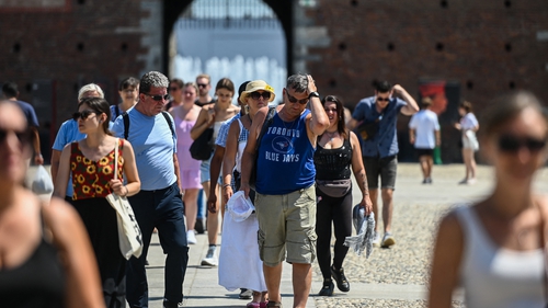 Tourists walk in Sforzesco castle in Milan last week amid a fierce heatwave which continues to sweep across Europe
