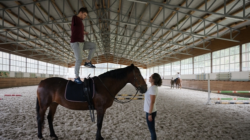 Anatoliy, 26 year-old Ukrainian soldier, who lost one arm in Mariupol, takes part in horse yoga in Lviv.