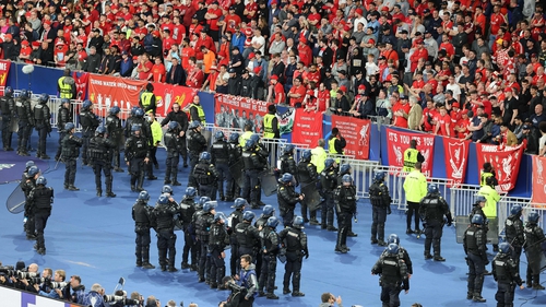 Riot police in front of the Liverpool fans after the Champions League final at the Stade de France