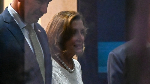 Nancy Pelosi leaves the Shangri-La Hotel following a reception at the American Chamber of Commerce in Singapore