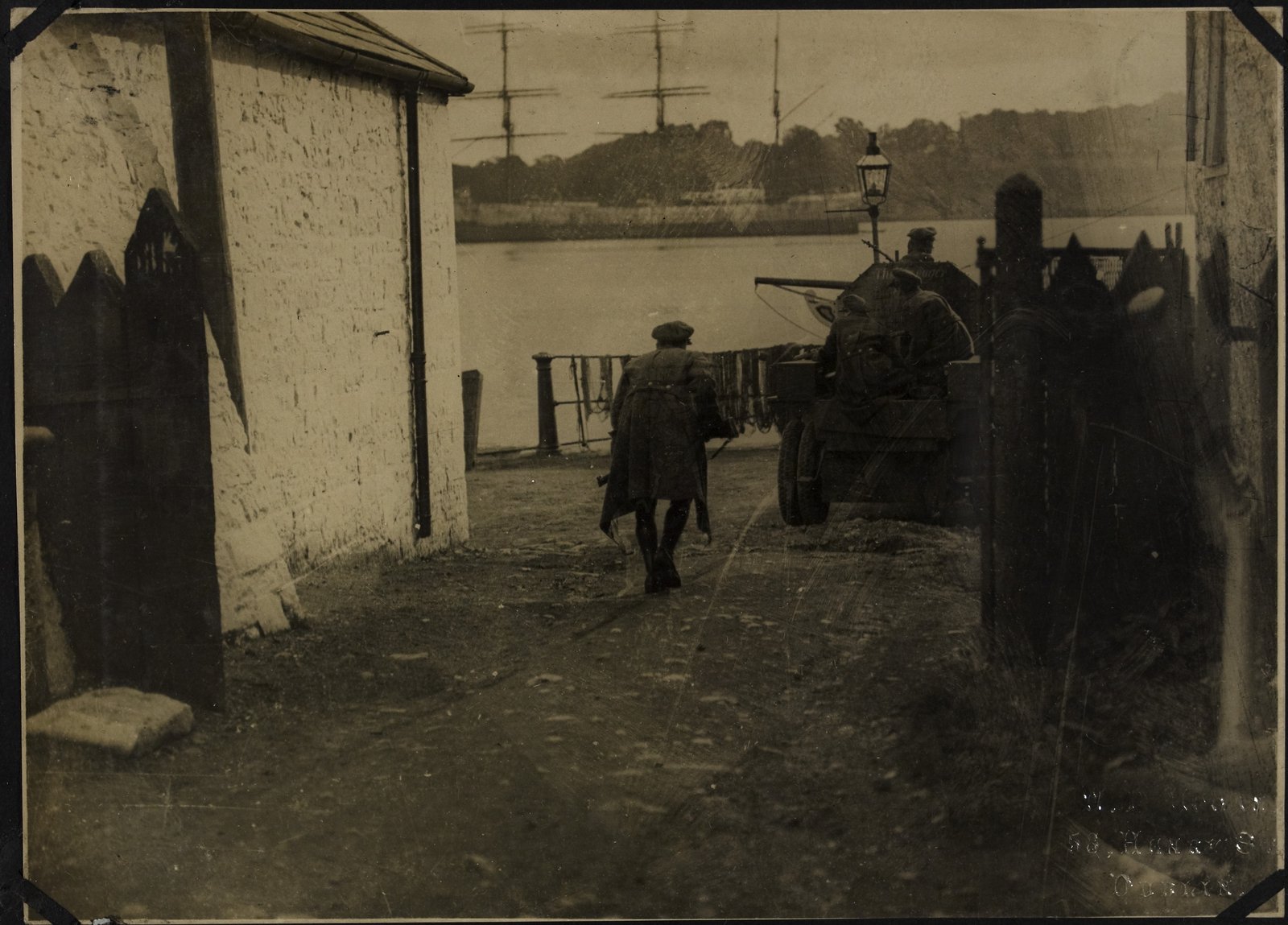Image - National Army troops patrolling streets in Passage West, trying to locate snipers. Image courtesy of the National Library of Ireland