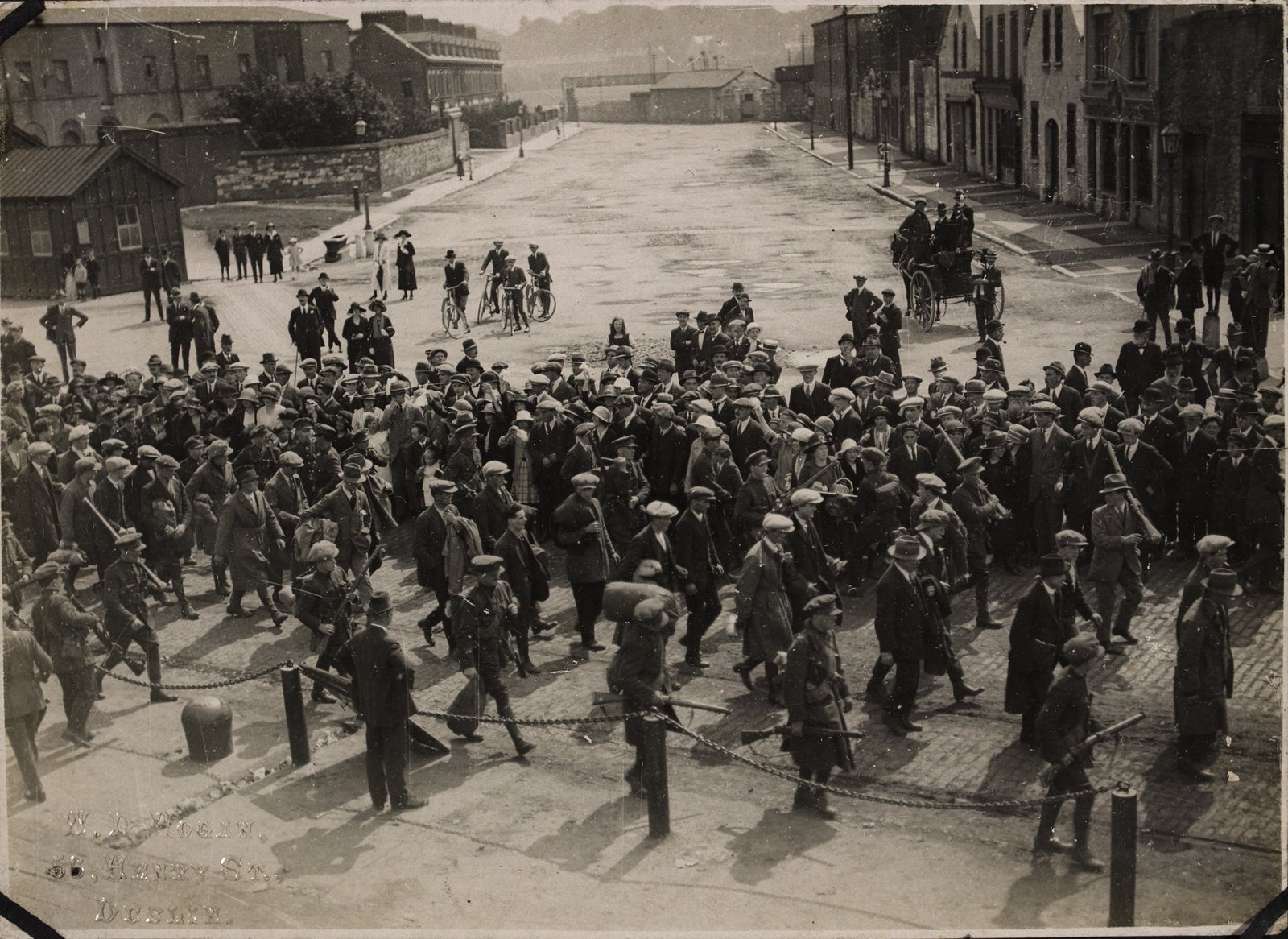 Image - Anti-Treaty prisoners captured during the attack on Passage West being marched to the Cork Gaol for detention. Image courtesy of the National Library of Ireland