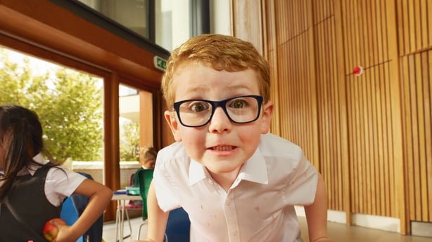 A child wearing glasses