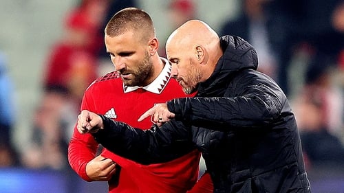Manchester United manager Erik ten Hag (R) speaks with Luke Shaw during friendly last month