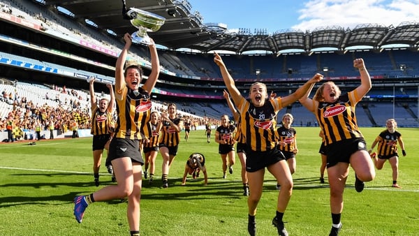 Kilkenny captain Aoife Prendergast, left, celebrates with the O'Duffy Cup and team-mates at Croke Park