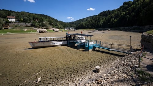 A boat sits on the dry riverbed of the Brenets Lake on the border between France and Switzerland. The river has dried up due to a combination of factors, including geological faults that drain the river, decreased rainfall and heatwaves